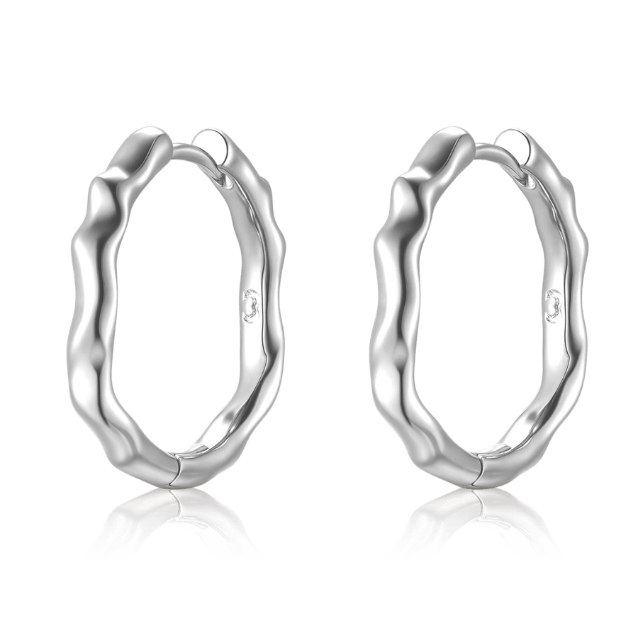 Boucles d’oreilles créoles ondulées · Argent