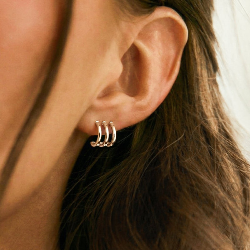 Boucles d’oreilles demi-créoles Triple Arcos